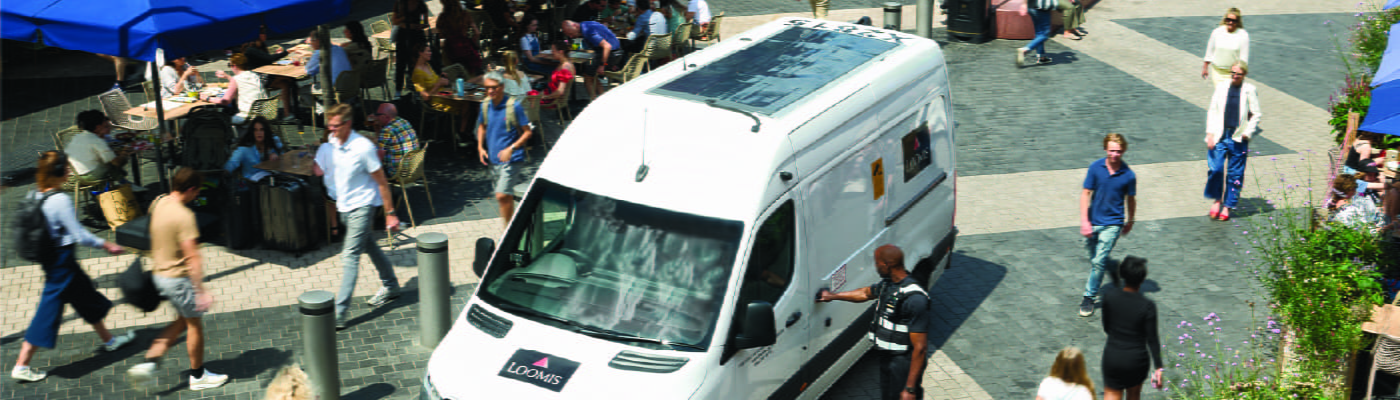 loomis-car-with-solar-panels-in-busy-town-square-100