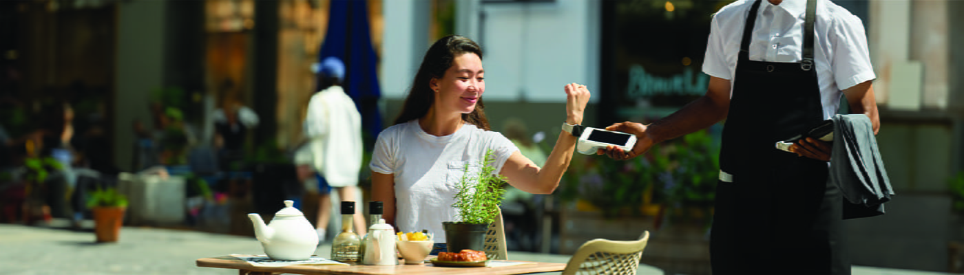 woman-paying-at-restaurant-with-loomis-pay-POS-100