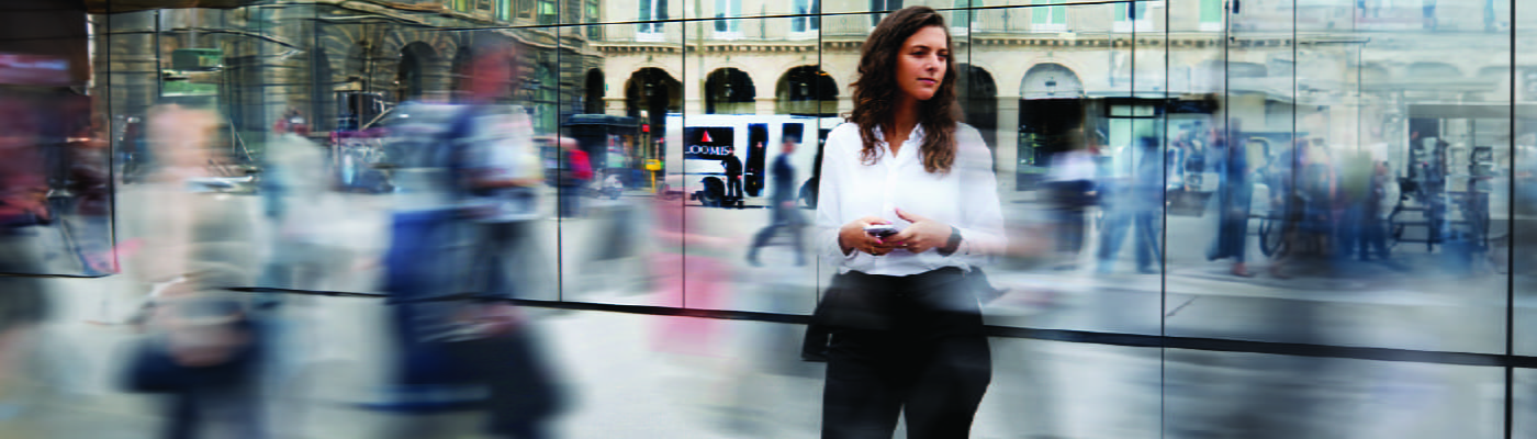 woman-standing-in-financial-district-loomis-car-driving-by-100