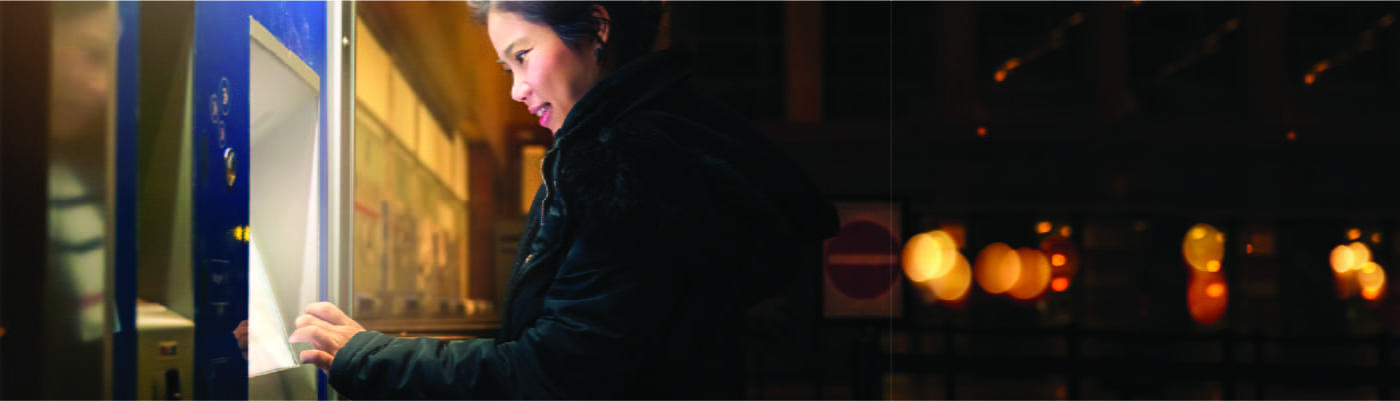 woman-withdrawing-cash-from-ATM-100